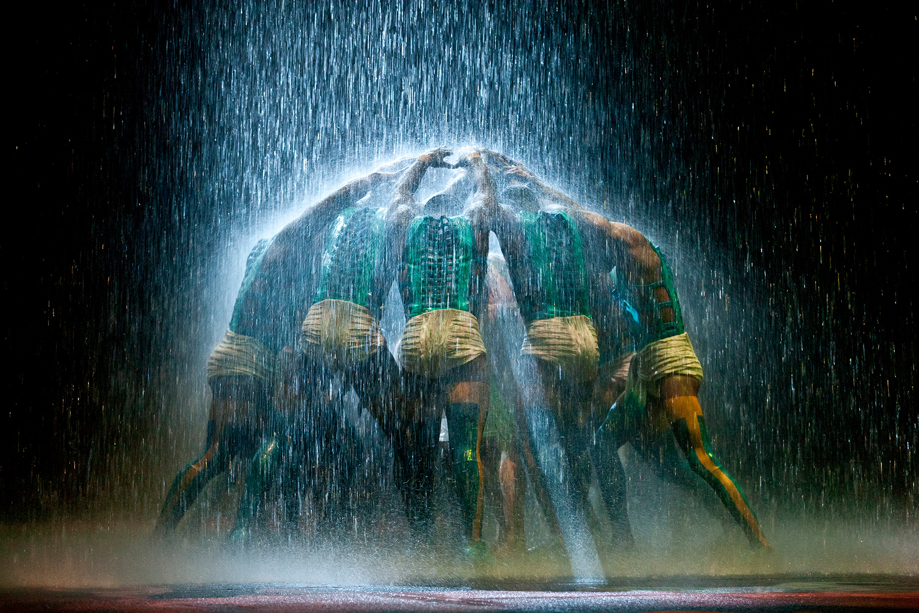 Acrobatic performers forming a roof. Cirque du Soleil, Dragone, The House of Dancing water