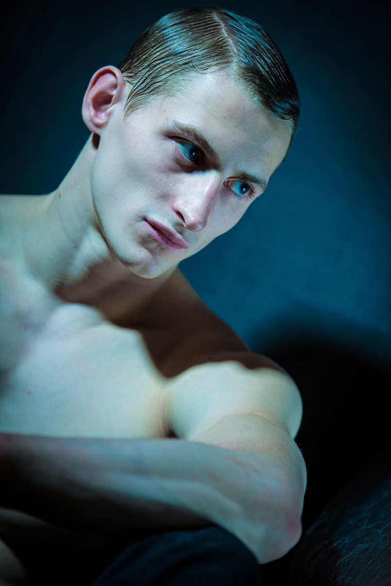 man in blue tint. Handsome man portrait. fine art. editorial