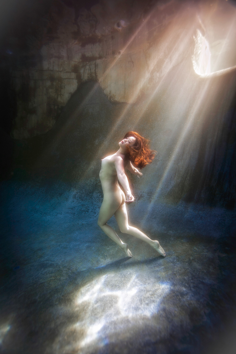 asian beauty floating nude underwater