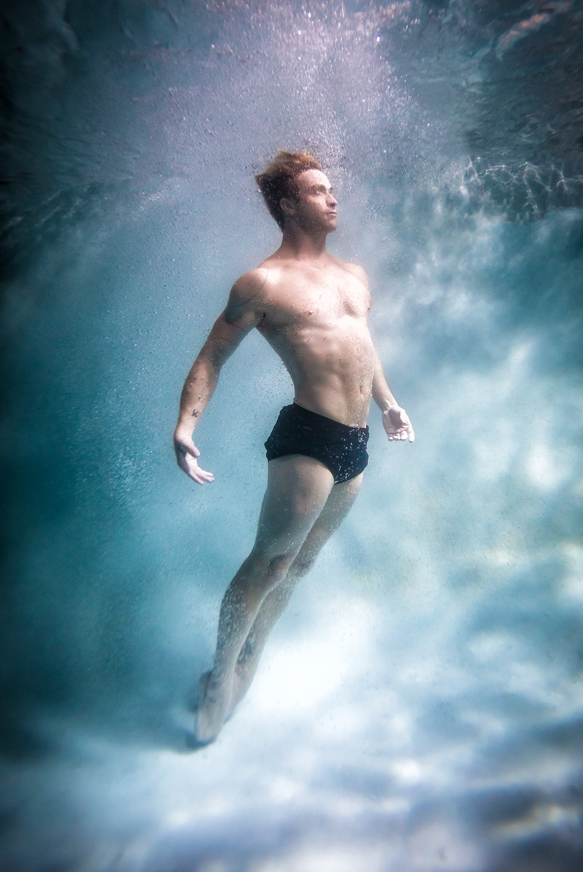 submerged dancer. Ballet dancer underwater commercial 